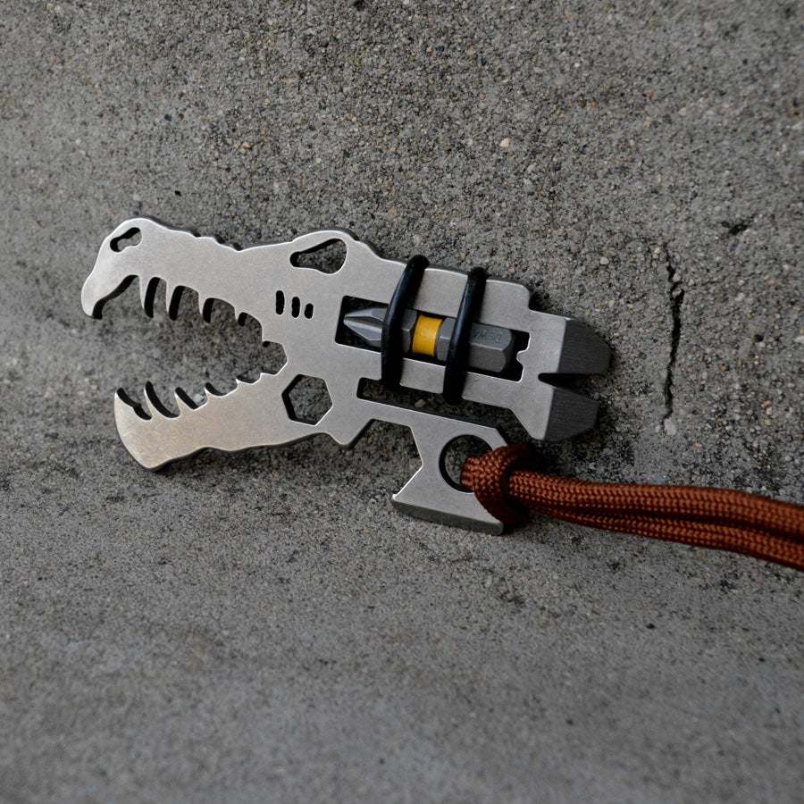 Jurassic Croc Multi-Tool featuring a dinosaur design with multiple functions including a bottle opener and pry bar.