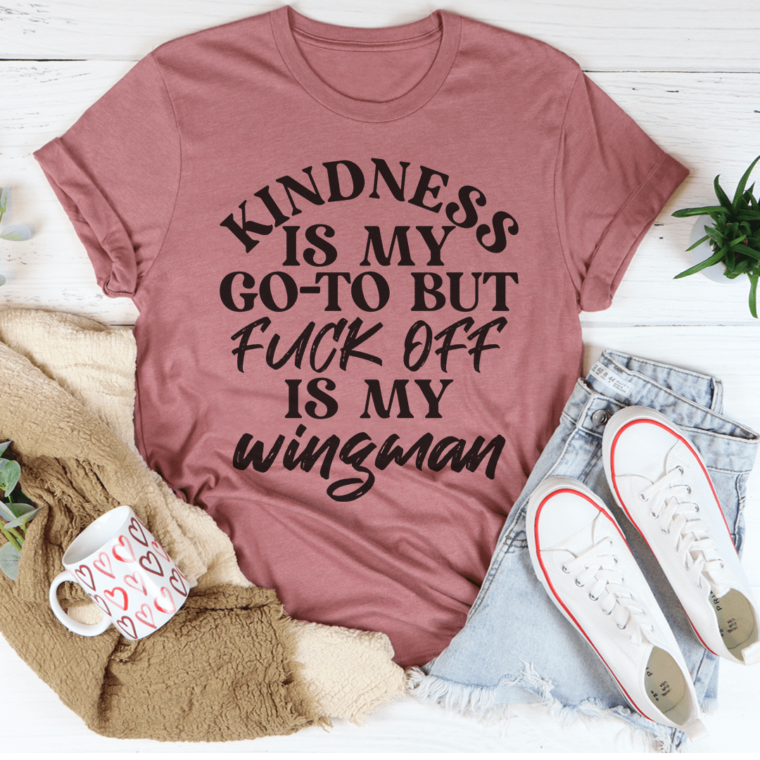 A soft and durable Kindness Is My Go-To Tee in various colors, showcasing its comfortable fit and stylish design.