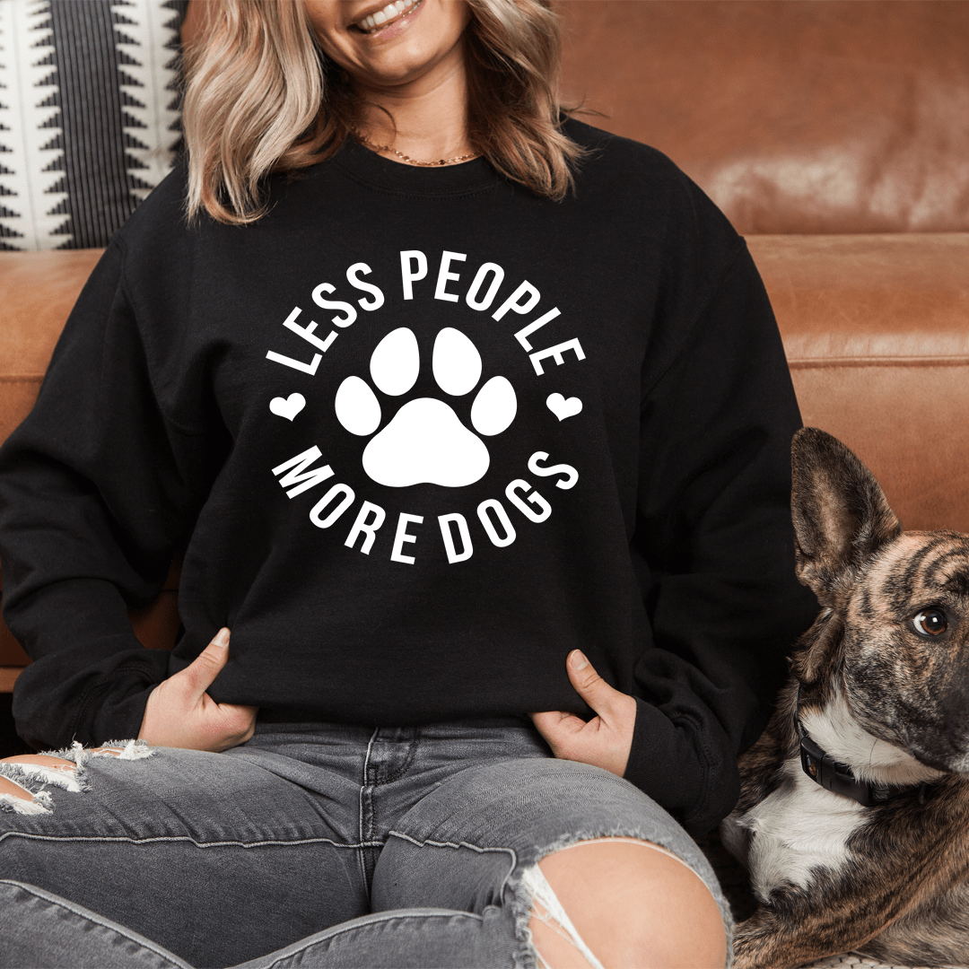 A cozy 'Less People More Dogs' sweatshirt featuring a stylish design, perfect for dog lovers.