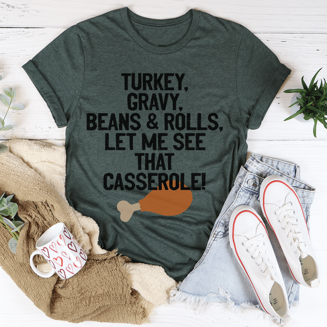 Let Me See That Casserole T-Shirt in various colors, showcasing its soft fabric and durable stitching.