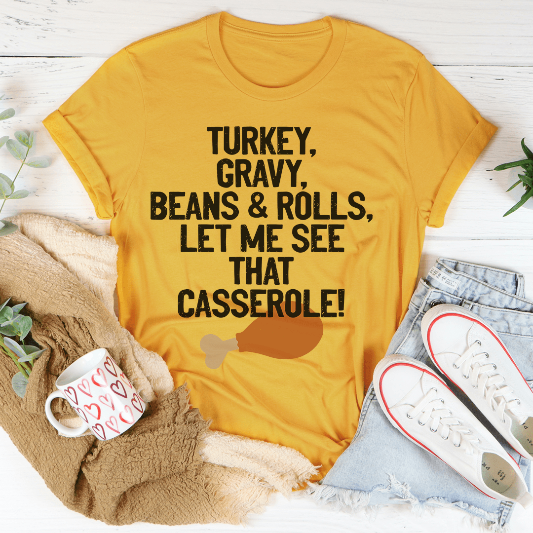 Let Me See That Casserole T-Shirt in various colors, showcasing its soft fabric and durable stitching.