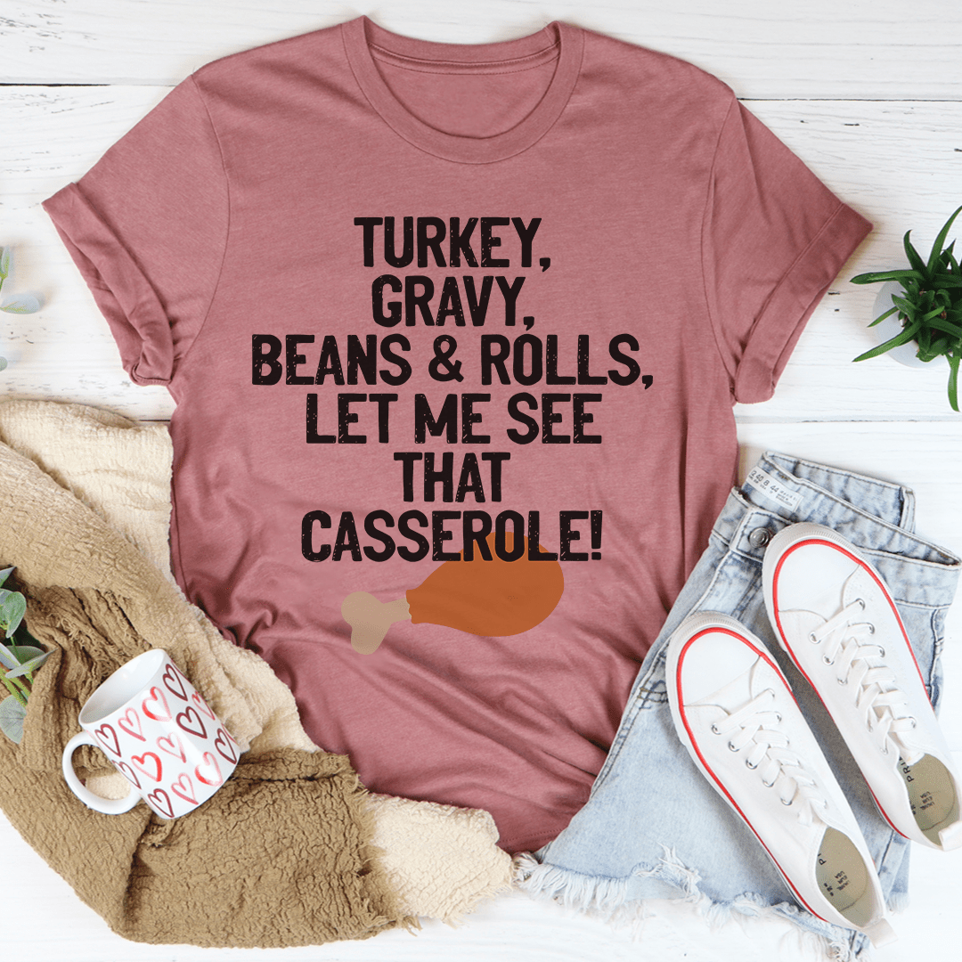 Let Me See That Casserole T-Shirt in various colors, showcasing its soft fabric and durable stitching.