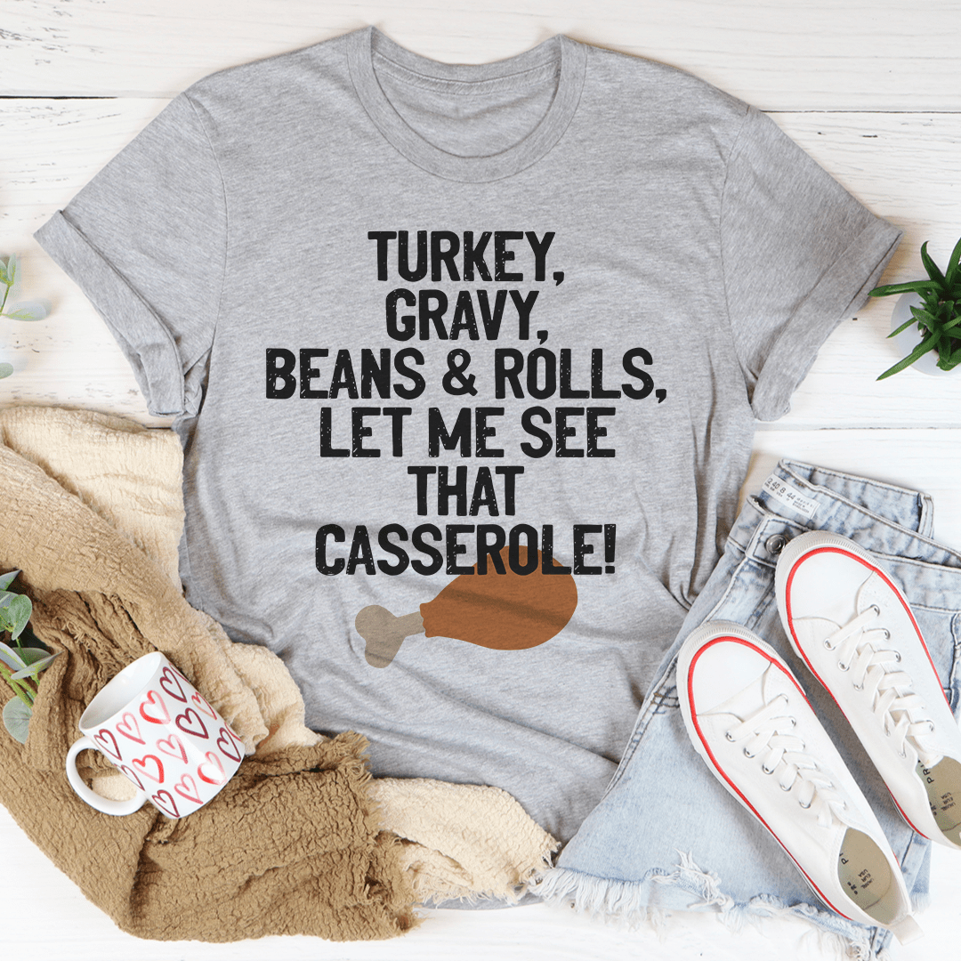 Let Me See That Casserole T-Shirt in various colors, showcasing its soft fabric and durable stitching.