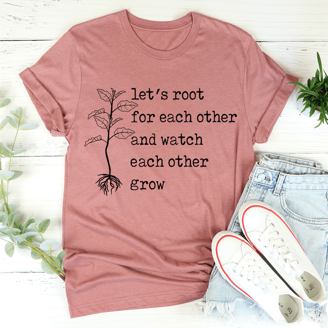 A soft, durable Let's Root For Each Other T-Shirt in various colors, featuring double stitching and a positive message.