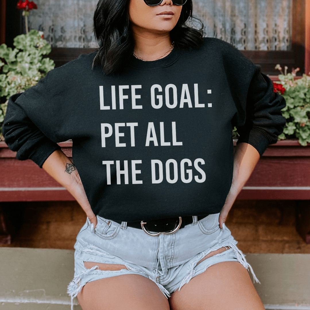 Cozy sweatshirt featuring the phrase 'Life Goal Pet All The Dogs', designed for dog lovers, made from soft cotton/poly fleece blend.