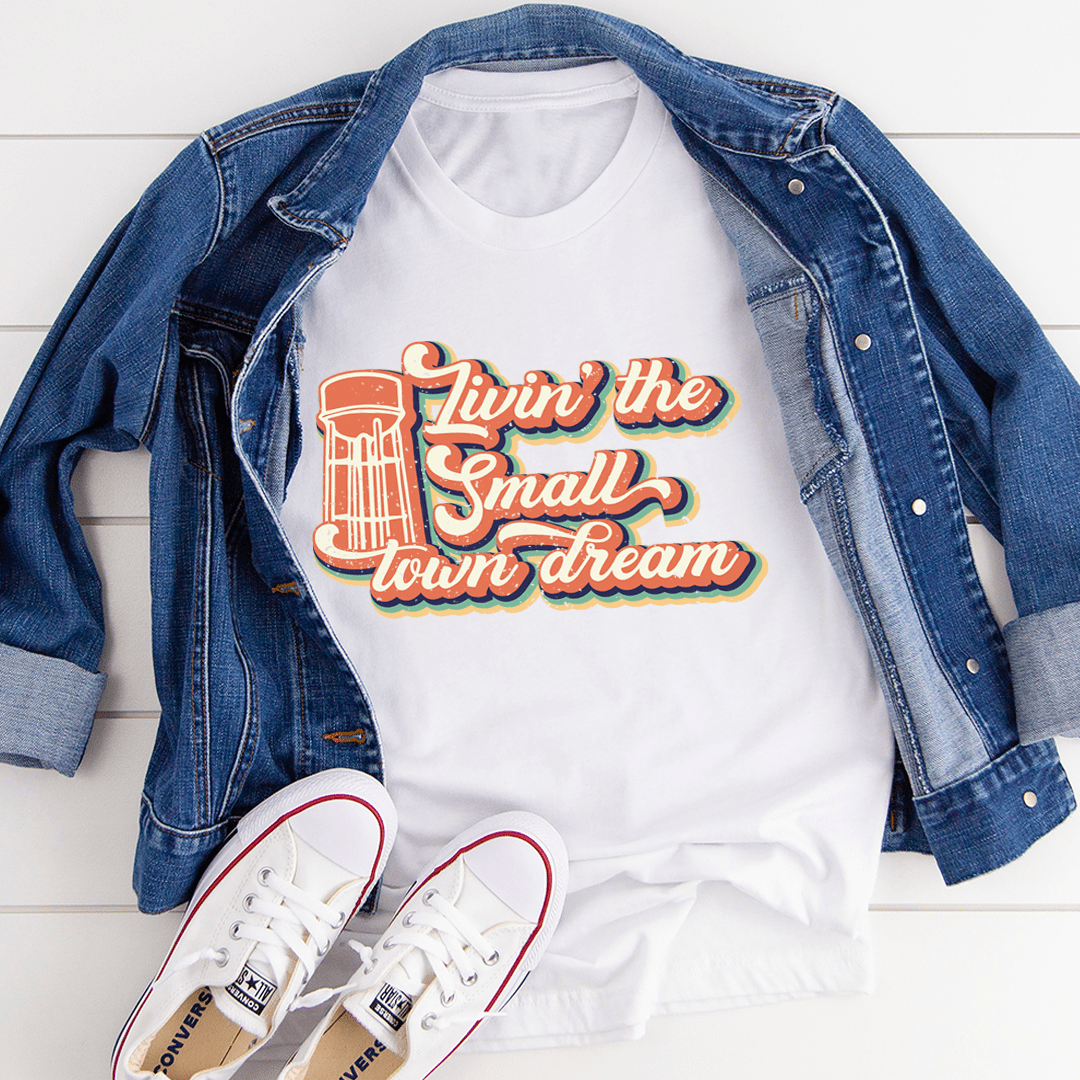 A comfortable and stylish Livin' The Small Town Dream Tee made from soft ring-spun cotton, featuring double stitching for durability.