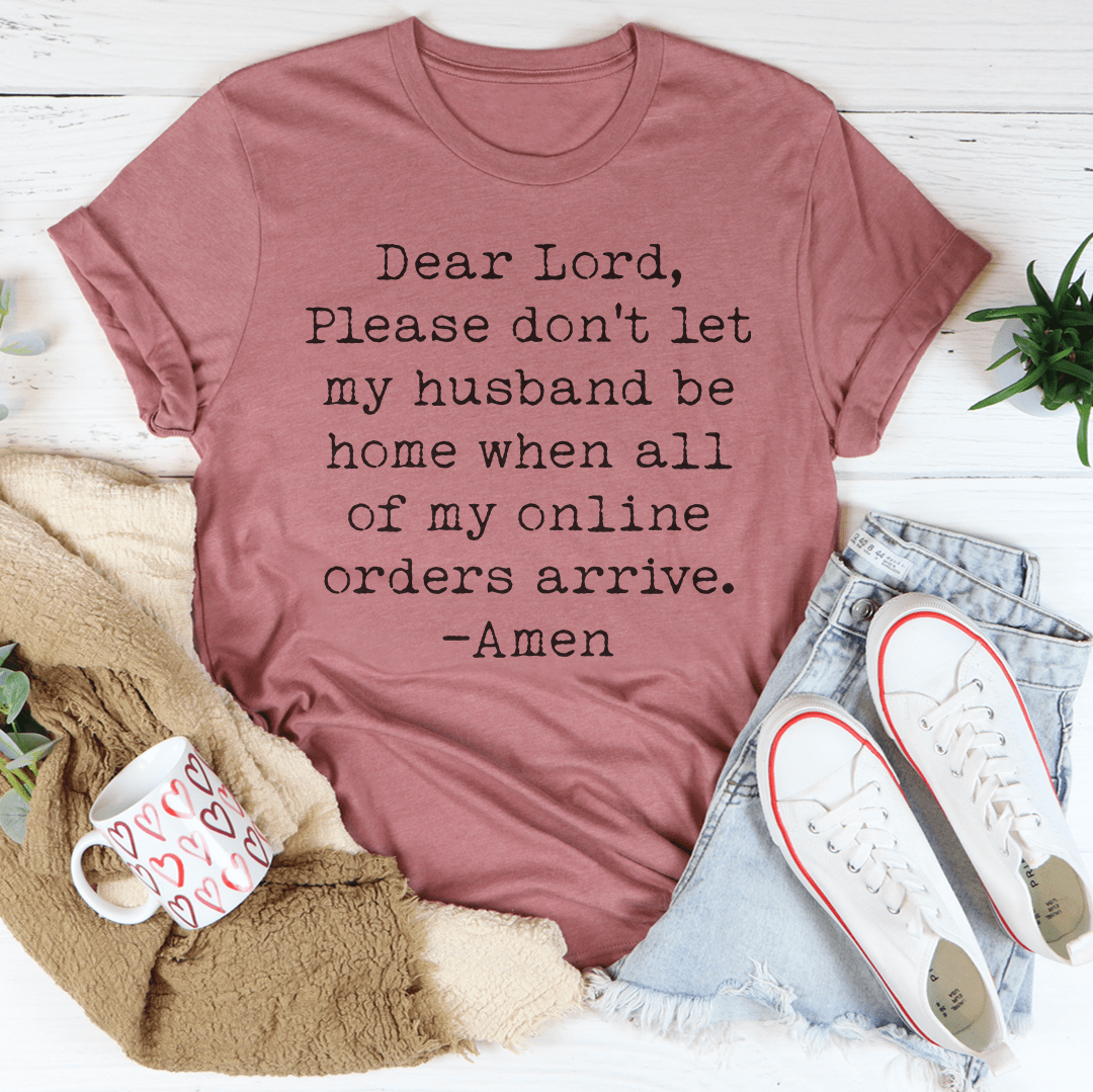 A comfortable and durable Lord Please Don't Let My Husband Be Home Tee made from soft ring-spun cotton, featuring double stitching for added durability.