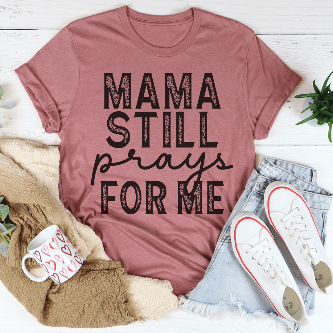 Mama Still Prays For Me T-Shirt in soft cotton, featuring a heartfelt design and durable stitching.