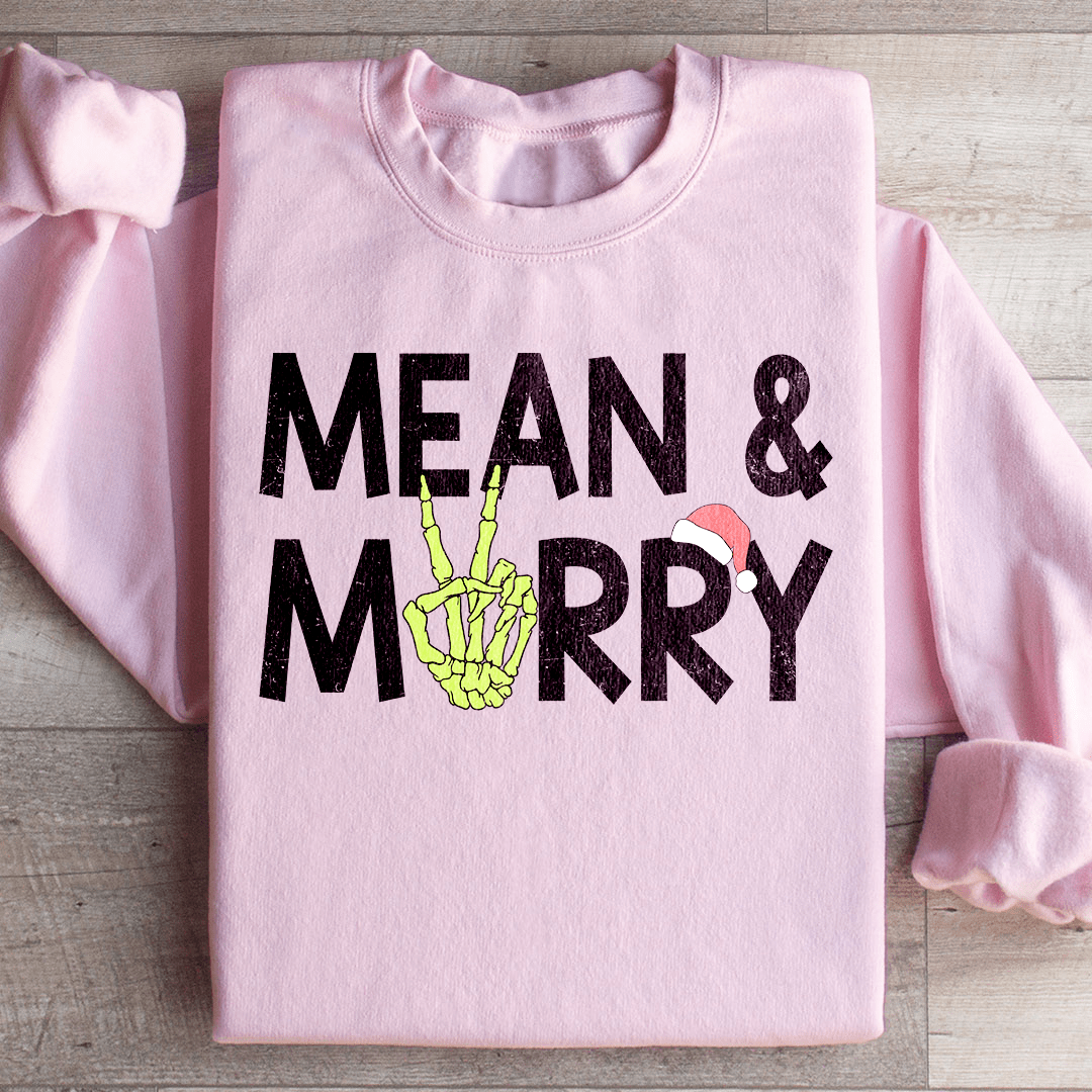 Mean & Merry sweats featuring unique artist designs, cozy fleece lining, and adjustable cuffs for warmth.