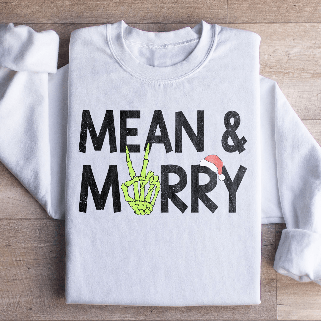 Mean & Merry sweats featuring unique artist designs, cozy fleece lining, and adjustable cuffs for warmth.