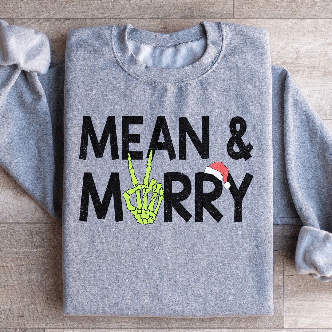 Mean & Merry sweats featuring unique artist designs, cozy fleece lining, and adjustable cuffs for warmth.