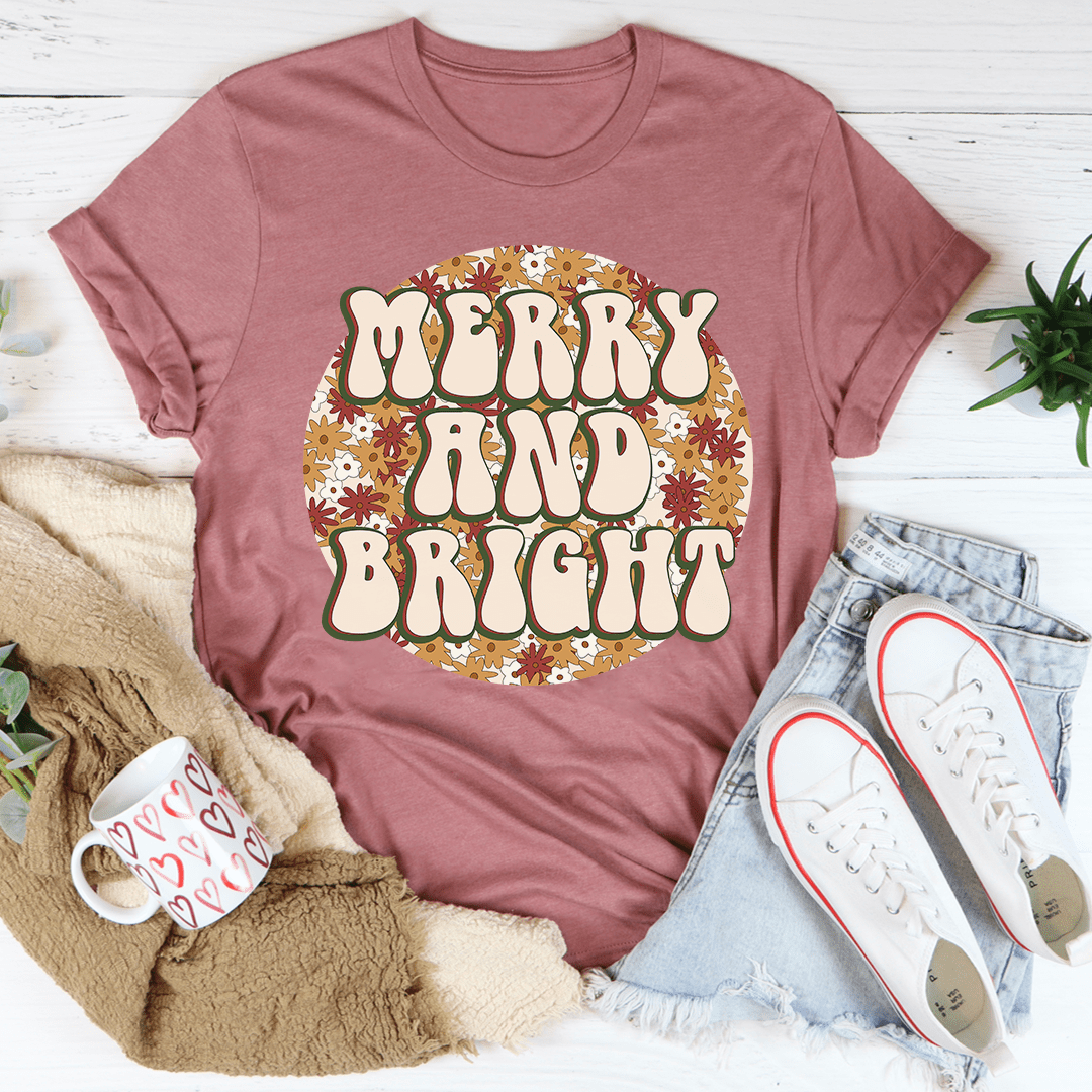 Merry And Bright Tee showcasing its soft cotton fabric and durable stitching, available in various sizes.