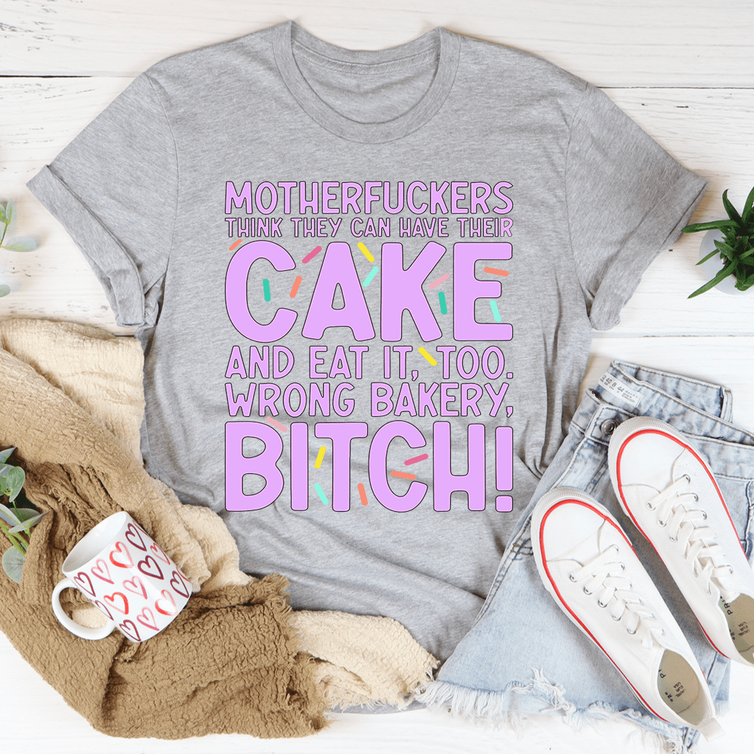 MFs Think They Can Have Their Cake And Eat It Too T-Shirt displayed on a mannequin, showcasing its soft cotton fabric and double-stitched neckline.