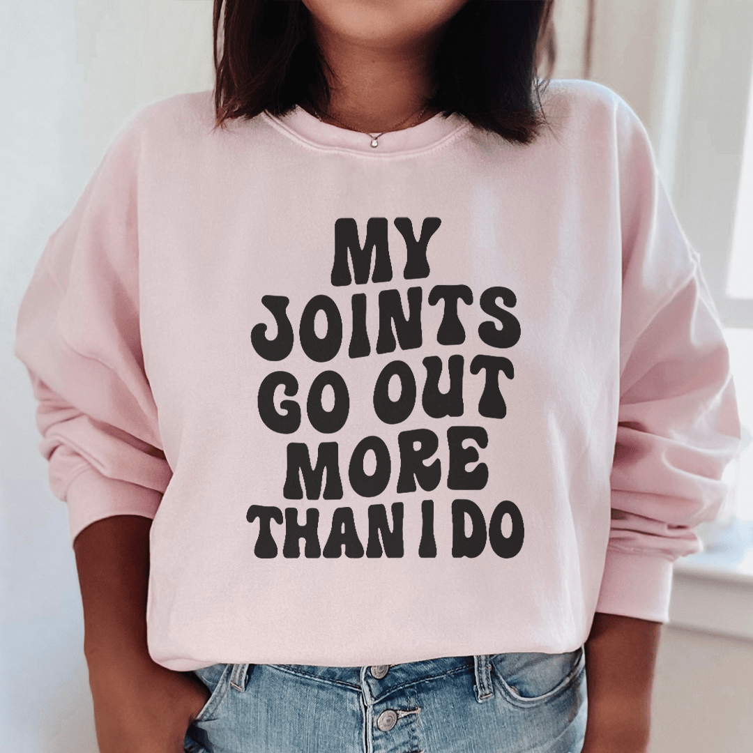 Cozy 'My Joints Go Out More Than I Do' sweats featuring unique designs by top artists, made from a warm cotton/poly fleece blend.