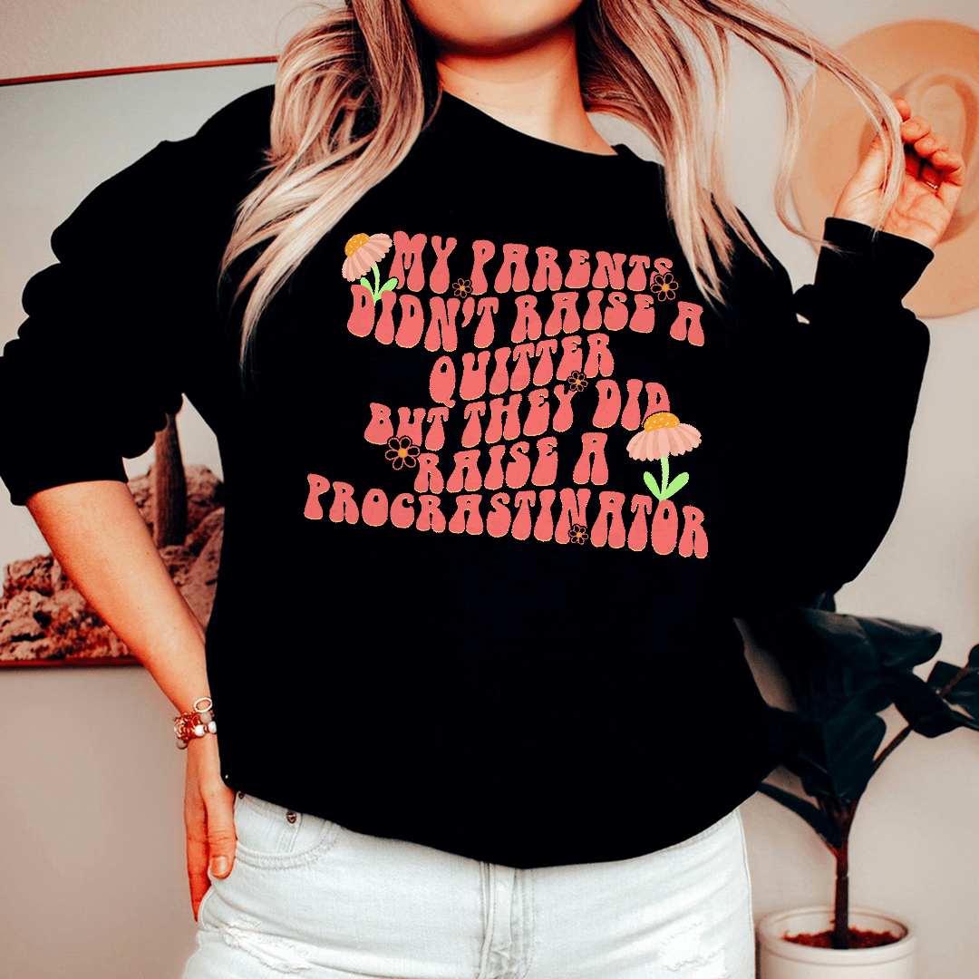 A cozy hoodie featuring the phrase 'My Parents Didn't Raise A Quitter', designed by top artists, made from cotton/poly fleece blend.