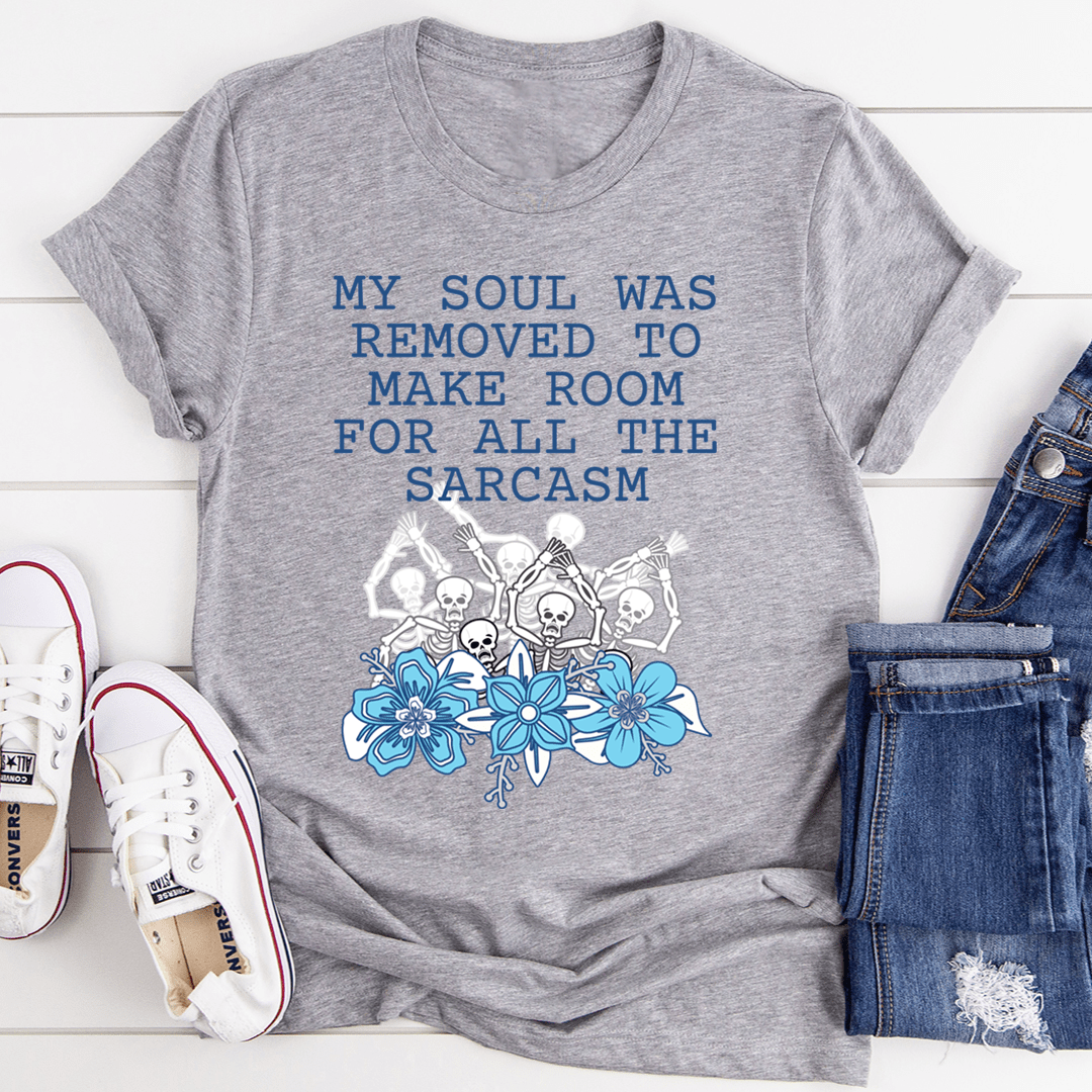 A stylish t-shirt featuring the phrase 'My Soul Was Removed To Make Room For All The Sarcasm' printed on soft ring-spun cotton fabric.