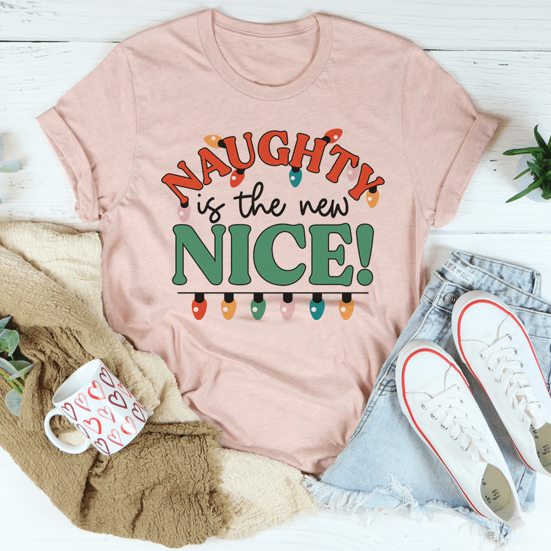 A stylish Naughty Is The New Nice Tee made from soft ring-spun cotton, featuring a playful design and durable double stitching.