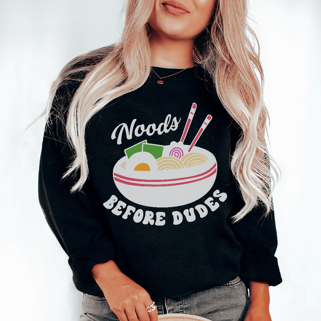 Noods Before Dudes sweats featuring unique artistic designs, made from a cozy cotton/poly fleece blend with adjustable cuffs.