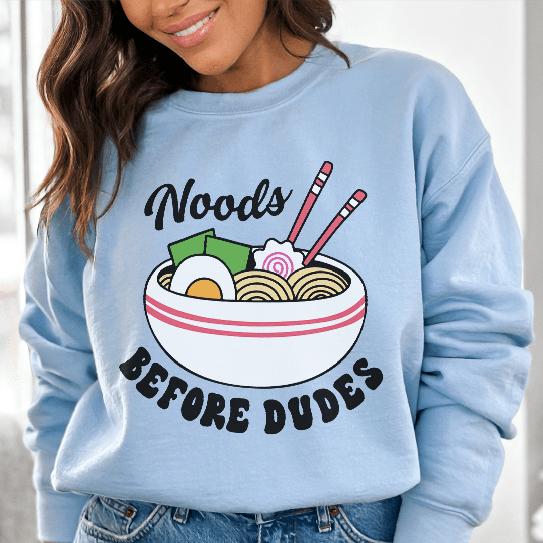 Noods Before Dudes sweats featuring unique artistic designs, made from a cozy cotton/poly fleece blend with adjustable cuffs.