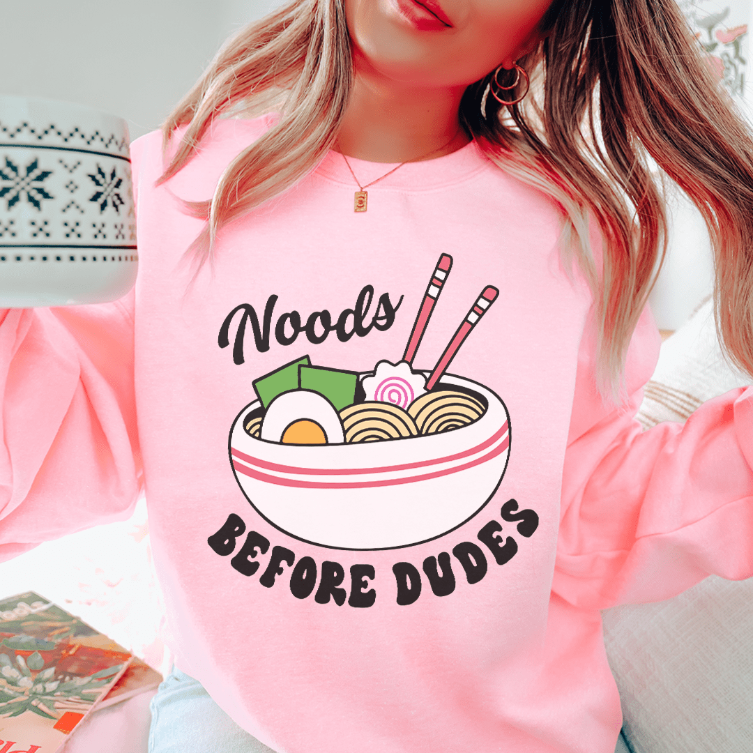 Noods Before Dudes sweats featuring unique artistic designs, made from a cozy cotton/poly fleece blend with adjustable cuffs.