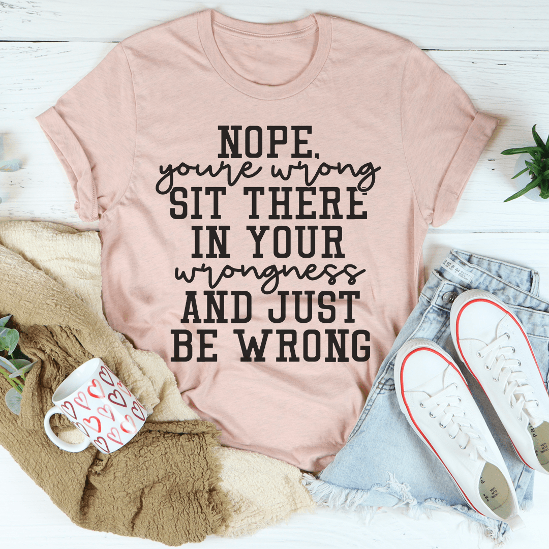 A stylish black t-shirt featuring the phrase 'Nope You're Wrong' in bold lettering, made from soft ring-spun cotton.