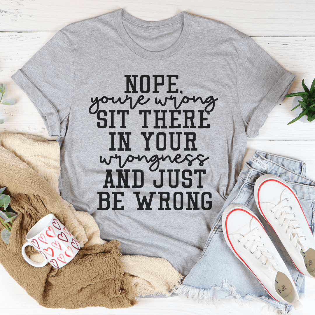 A stylish black t-shirt featuring the phrase 'Nope You're Wrong' in bold lettering, made from soft ring-spun cotton.