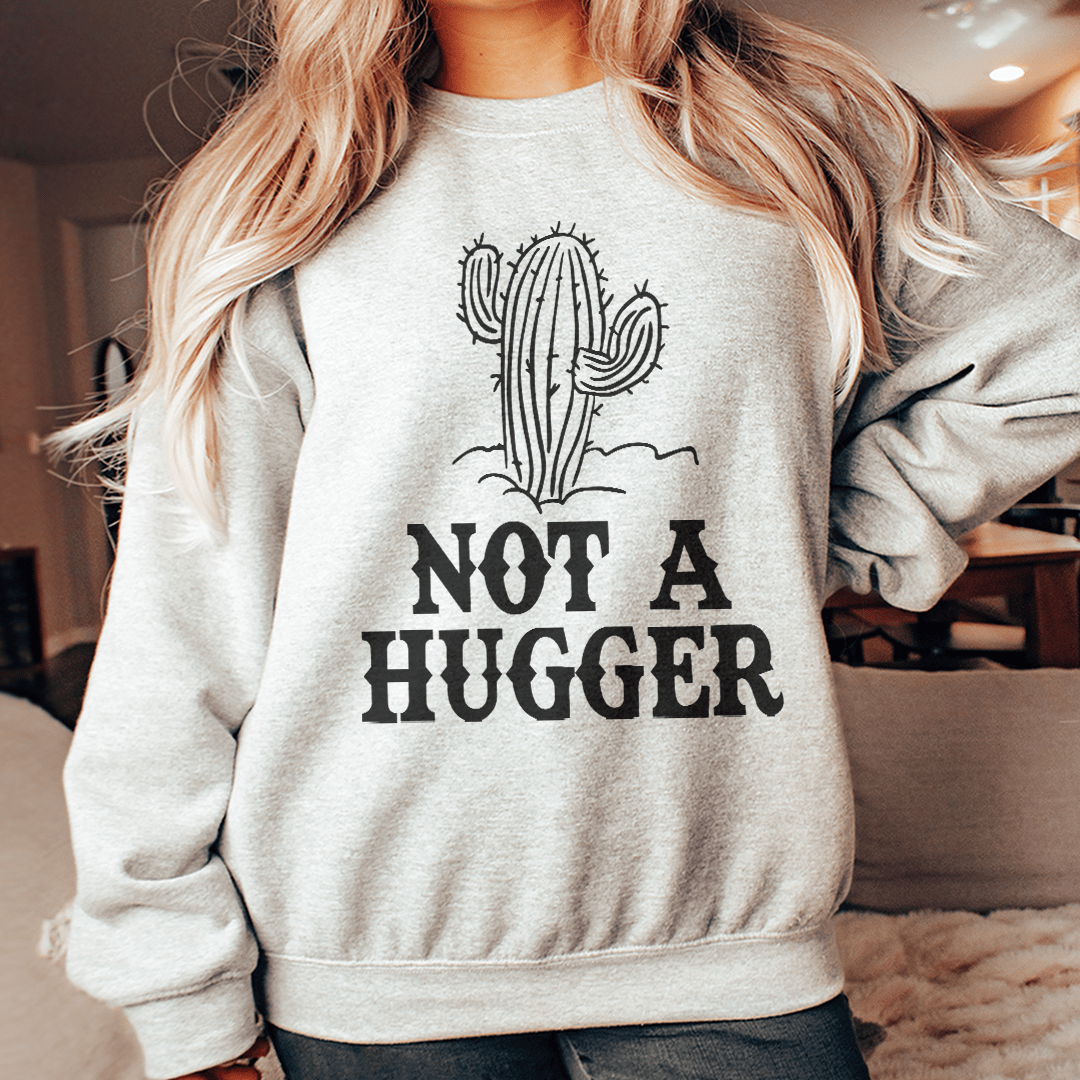 Not A Hugger sweatshirt featuring unique artistic designs, made from a cozy cotton/poly fleece blend with adjustable cuffs.