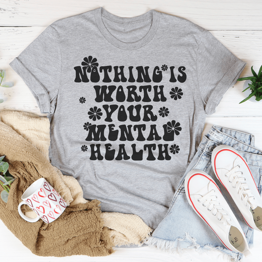 A comfortable and stylish t-shirt featuring the phrase 'Nothing Is Worth Your Mental Health', made from soft ring-spun cotton with durable stitching.