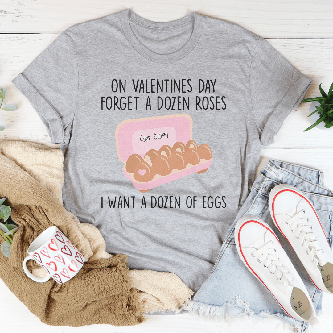 A soft cotton t-shirt featuring the phrase 'Forget A Dozen Roses' in a playful font, perfect for Valentine's Day.