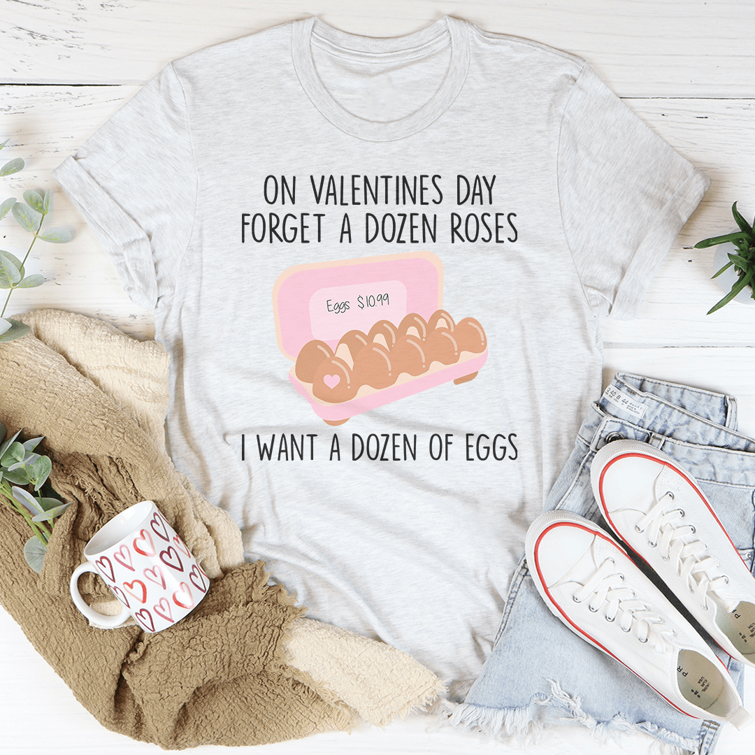 A soft cotton t-shirt featuring the phrase 'Forget A Dozen Roses' in a playful font, perfect for Valentine's Day.