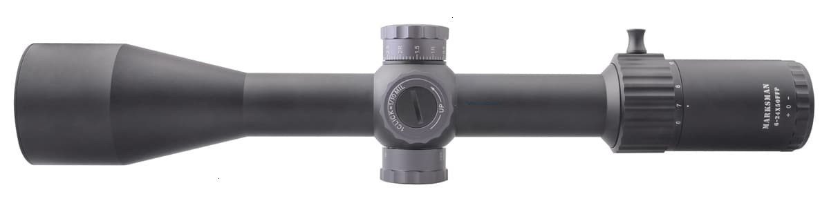 Rifle scope with adjustment dials.