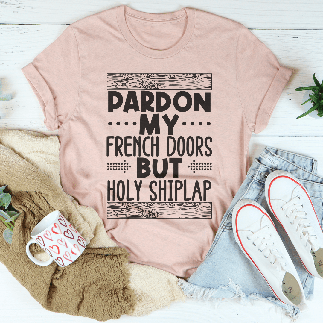 A stylish Pardon My French Doors But Holy Shiplap Tee made of soft ring-spun cotton, featuring a fun printed design.