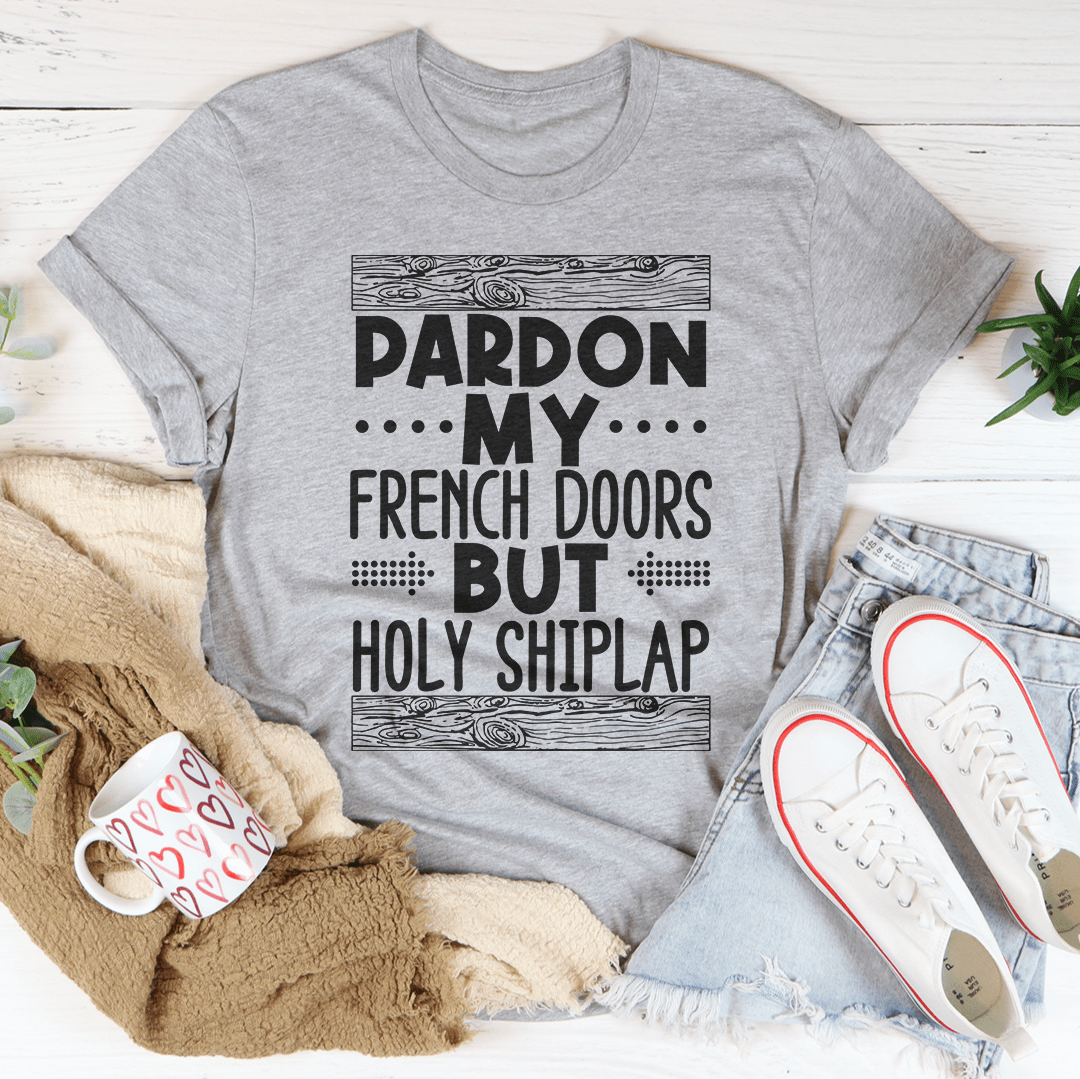 A stylish Pardon My French Doors But Holy Shiplap Tee made of soft ring-spun cotton, featuring a fun printed design.