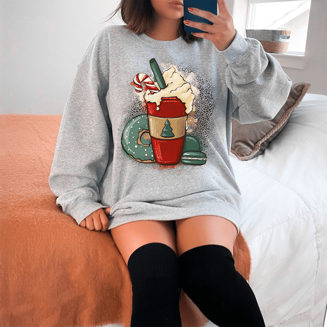 A cozy Peppermint Mocha hoodie made from a soft cotton/poly fleece blend, featuring adjustable banded cuffs and unique artistic designs.