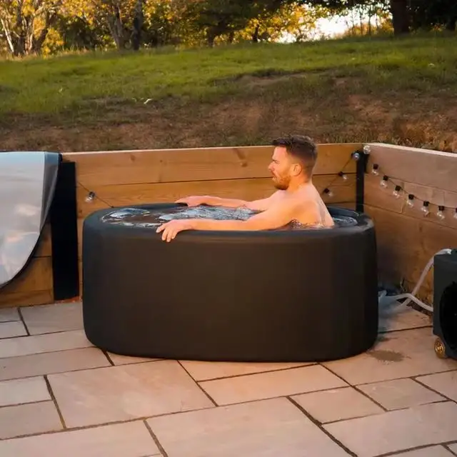 Man relaxing in outdoor hot tub.