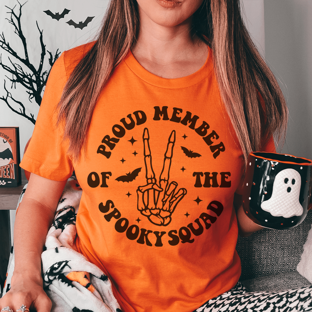 A black t-shirt featuring the text 'Proud Member Of The Spooky Squad' in a fun, spooky font, perfect for Halloween lovers.