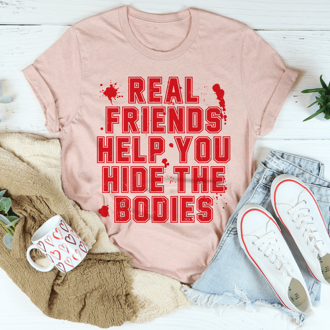 A stylish black t-shirt featuring the phrase 'Real Friends Help You Hide The Bodies' in bold white lettering, showcasing its comfortable fit and quality fabric.