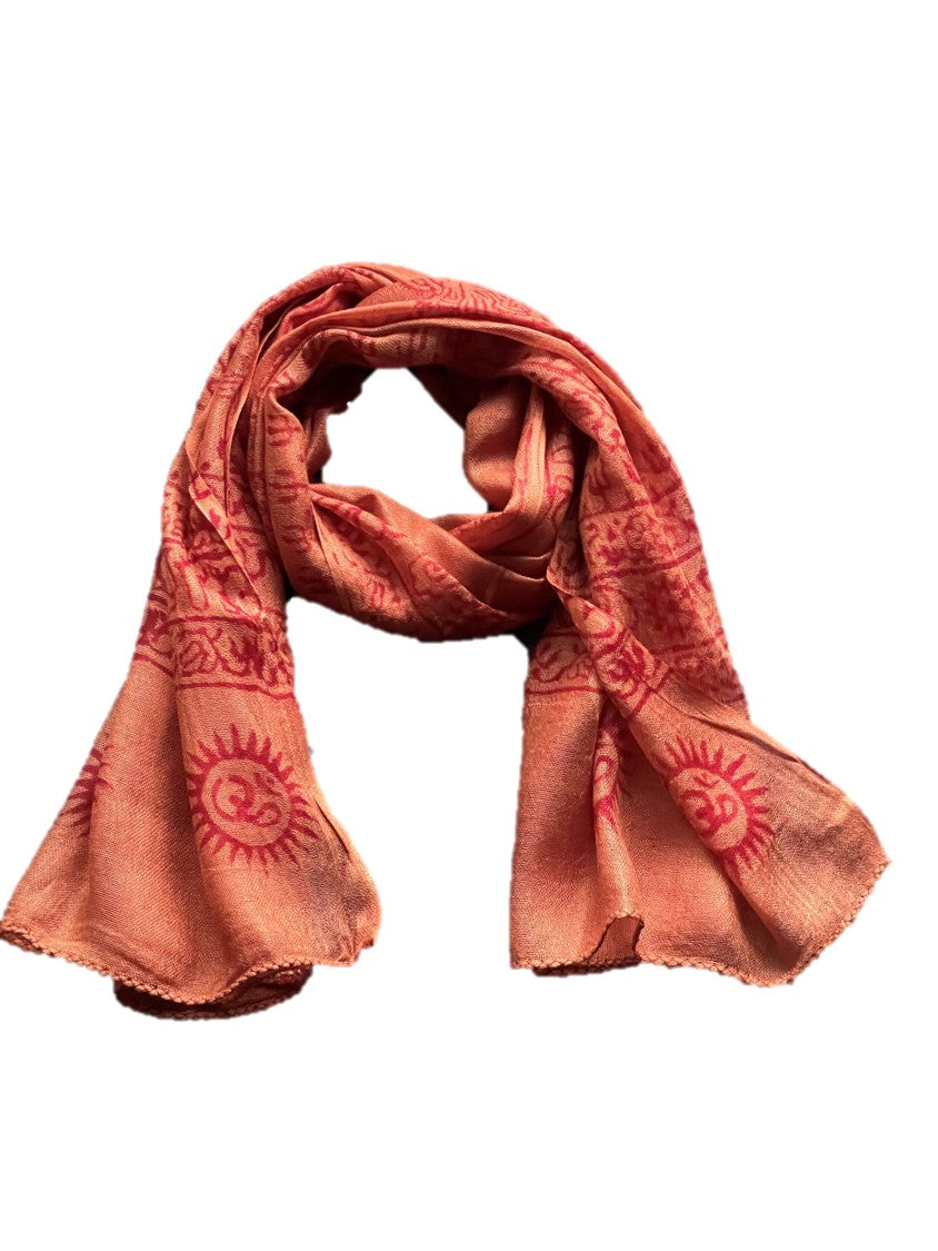 A vibrant Sanskrit Mantra scarf featuring the OM symbol and sacred designs in red on a colored background, made from soft Cotton Rayon fabric.