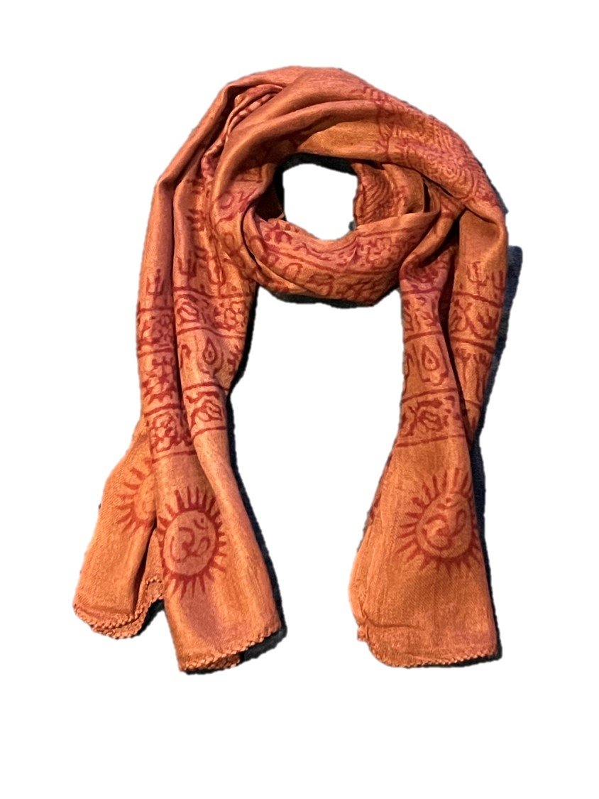 A vibrant Sanskrit Mantra scarf featuring the OM symbol and sacred designs in red on a colored background, made from soft Cotton Rayon fabric.