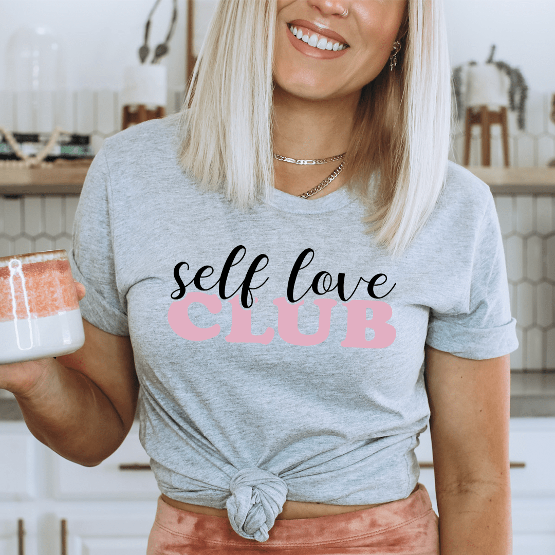 A stylish Self Love Club T-Shirt made from soft ring-spun cotton, featuring a bold self-love message, perfect for casual wear.