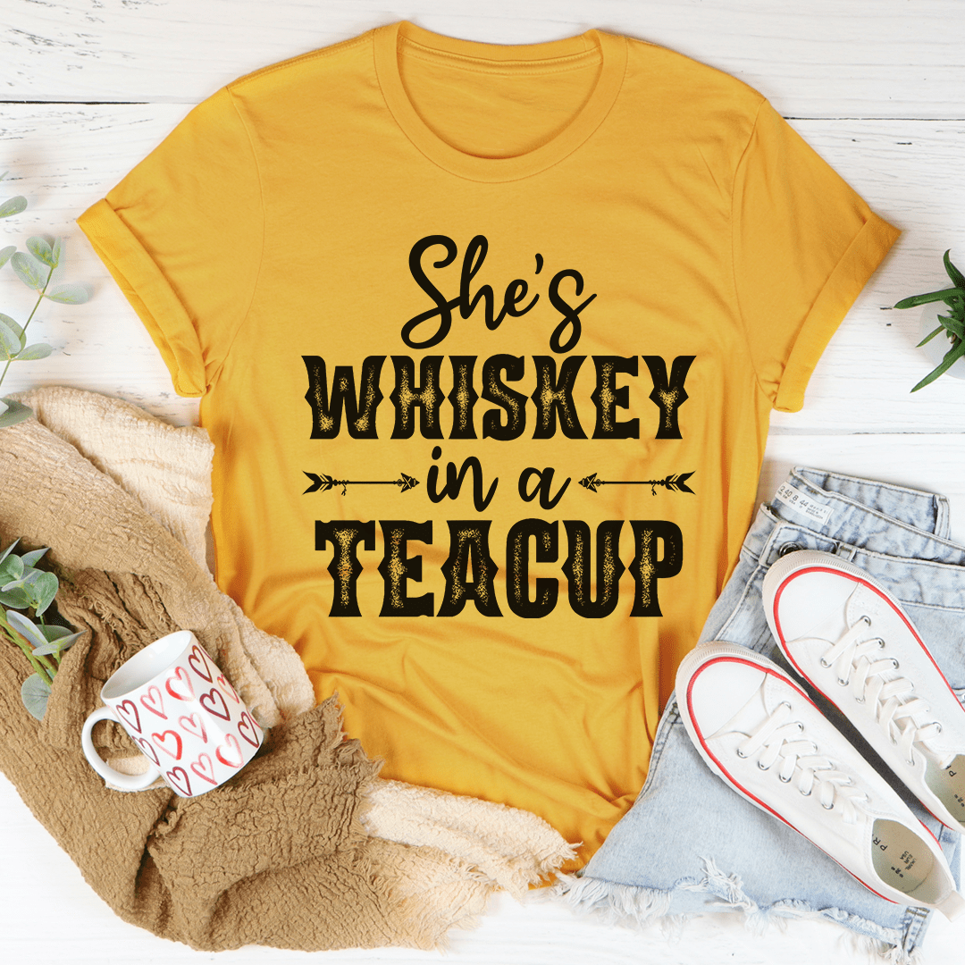 She's Whiskey In A Teacup T-Shirt displayed on a mannequin, showcasing its soft cotton fabric and stylish design.