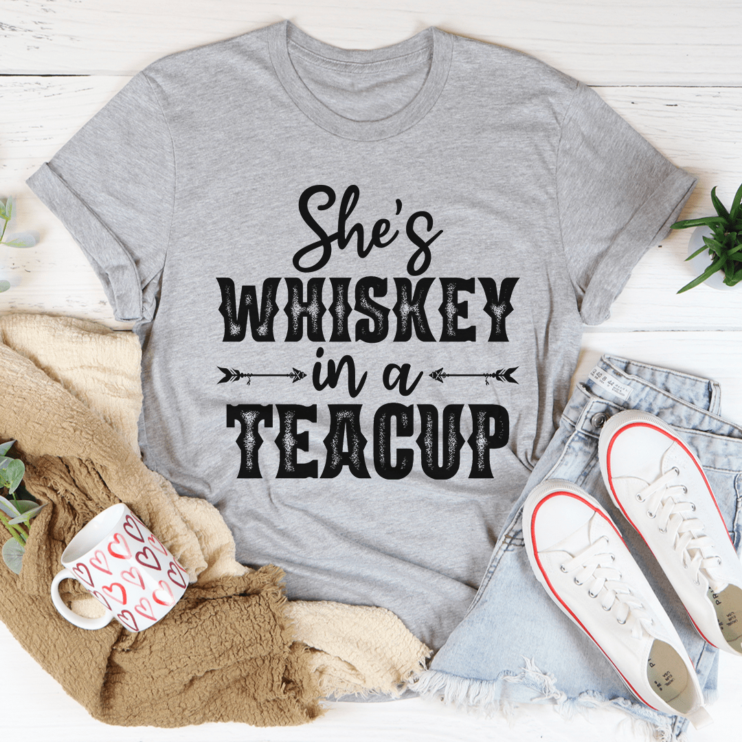 She's Whiskey In A Teacup T-Shirt displayed on a mannequin, showcasing its soft cotton fabric and stylish design.