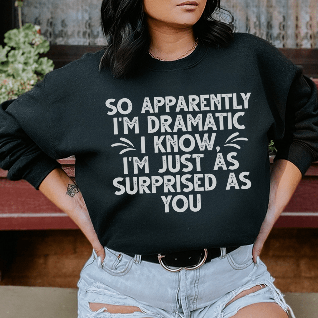 A cozy hoodie featuring the phrase 'So Apparently I'm Dramatic', designed by top artists, showcasing a stylish and comfortable fit.