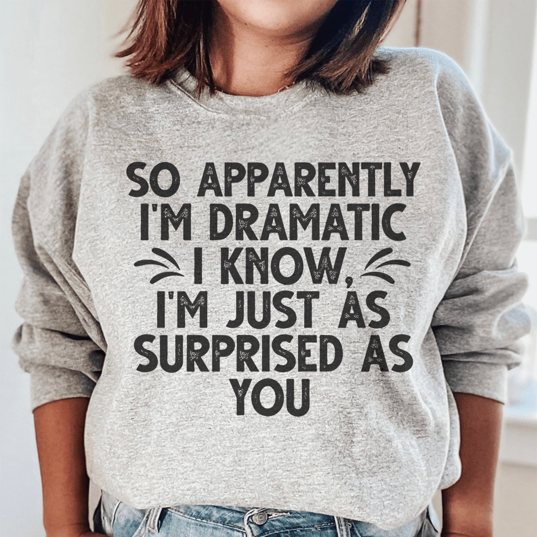 A cozy hoodie featuring the phrase 'So Apparently I'm Dramatic', designed by top artists, showcasing a stylish and comfortable fit.