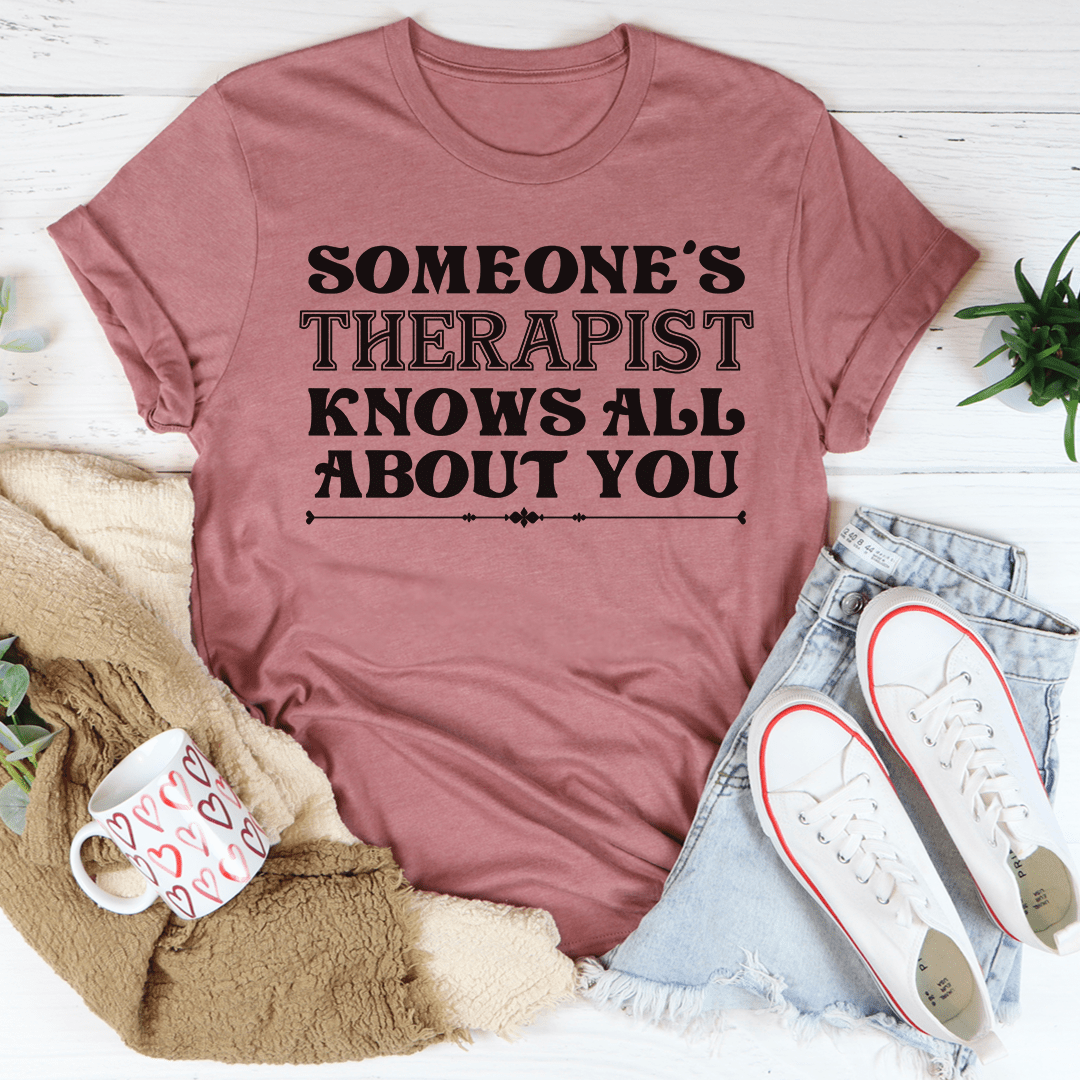 Someone's Therapist Knows All About You Tee, a soft cotton t-shirt with double stitching, available in various sizes.