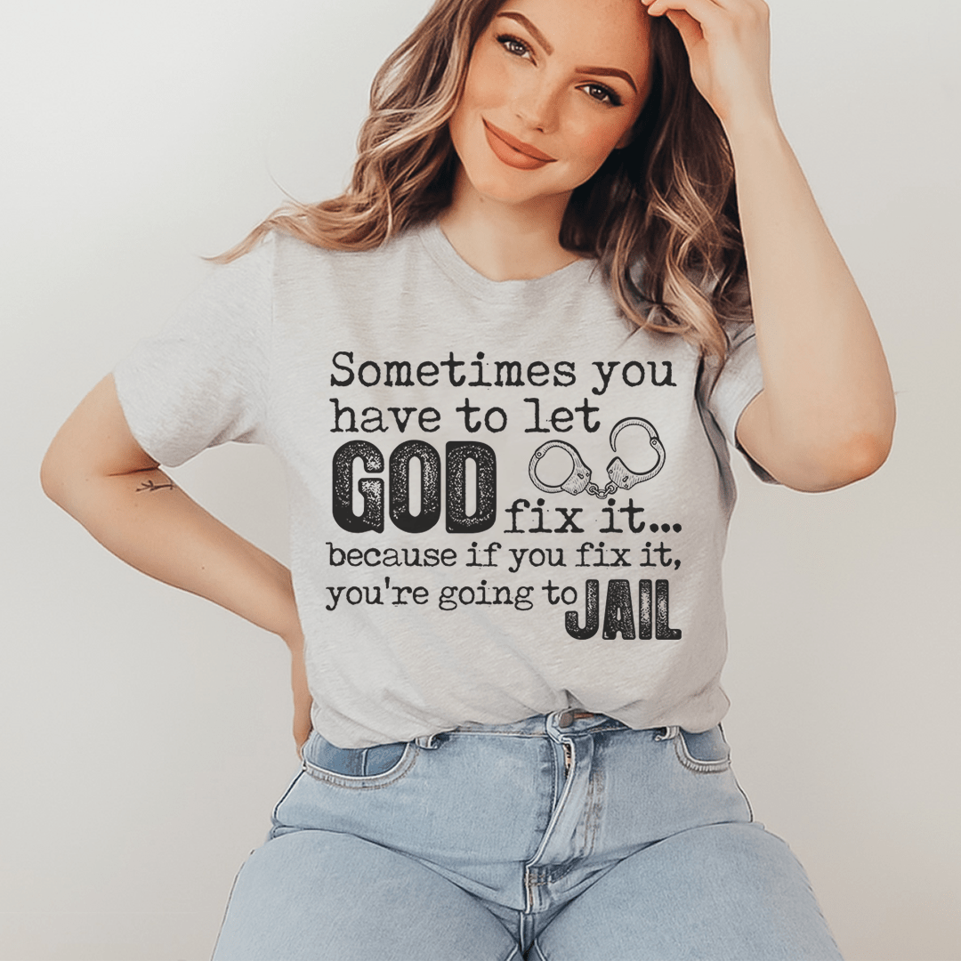 A comfortable and stylish t-shirt featuring the phrase 'Sometimes You Have To Let God Fix It' printed on it, made from soft ring-spun cotton.