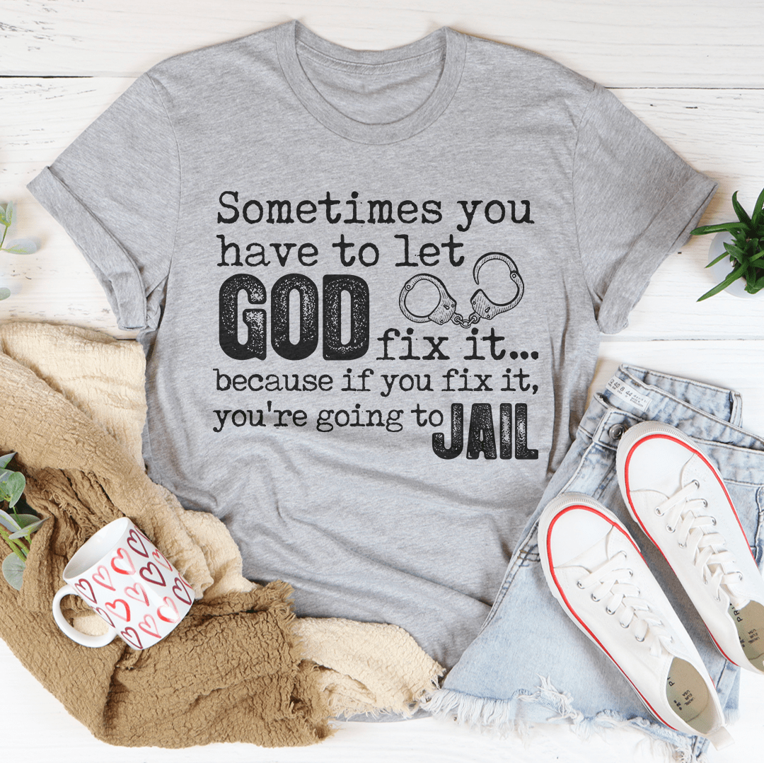 A comfortable and stylish t-shirt featuring the phrase 'Sometimes You Have To Let God Fix It' printed on it, made from soft ring-spun cotton.