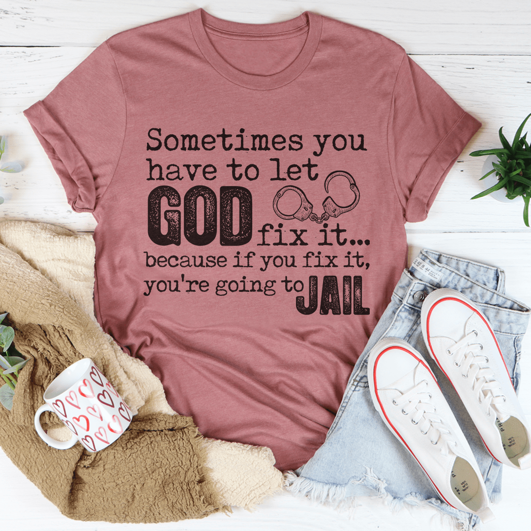 A comfortable and stylish t-shirt featuring the phrase 'Sometimes You Have To Let God Fix It' printed on it, made from soft ring-spun cotton.