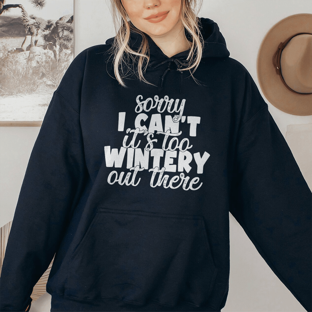 Cozy 'Sorry I Can't It's Too Wintery Out There' hoodie in soft cotton, featuring a fun winter-themed design.