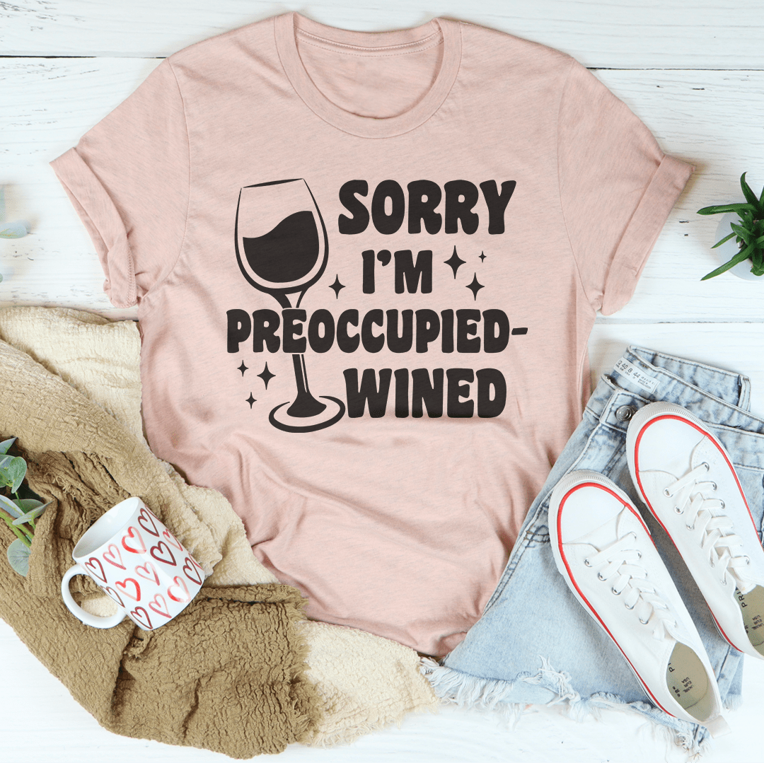 A stylish wined t-shirt with the text 'Sorry I’m Preoccupied' printed on it, showcasing its soft fabric and durable stitching.